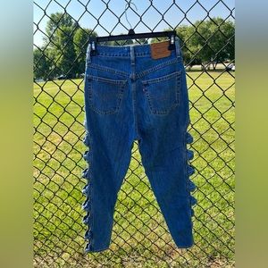 Levi jeans with bow detailing down each leg in size 26.